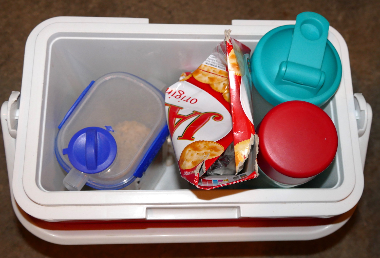 the esky contains hot water, jatz biscuits, cereal, empty shaker bottle