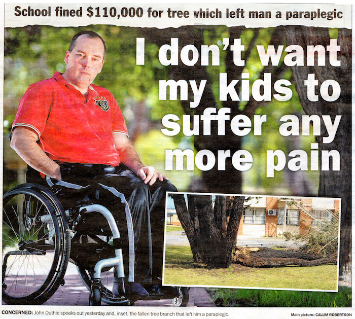 front page news showing me in my wheelchair wearing a red shirt and track pants - photographed after the safework sa prosecution