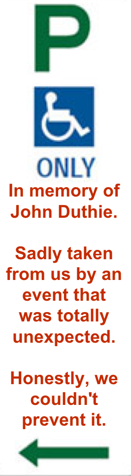 the accessible parking sign that reads 'in memory of john duthie. Sadly taken from us by an event that was totally unexpected. Honestly, we couldn't prevent it. Very close to the site of the fallen tree