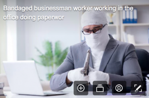 disability stock photographs - man in business suit and dressed as a mummy too holding a gun which is rediculous