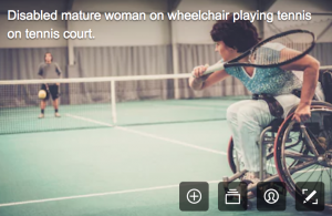 disability stock photographs - a woman playing tennis in a wheelchair