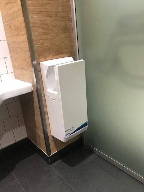 The powered hand dryer is next to the glass. Not enough room to wash hands. Scentre Group accessibility needs to improve.