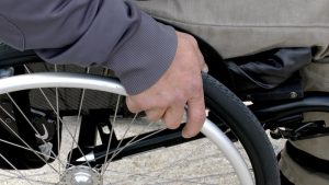 Wheelchair user propelling a manual wheelchair independently